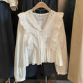 BLUSA CON VOLANTES Y CUELLO EN V